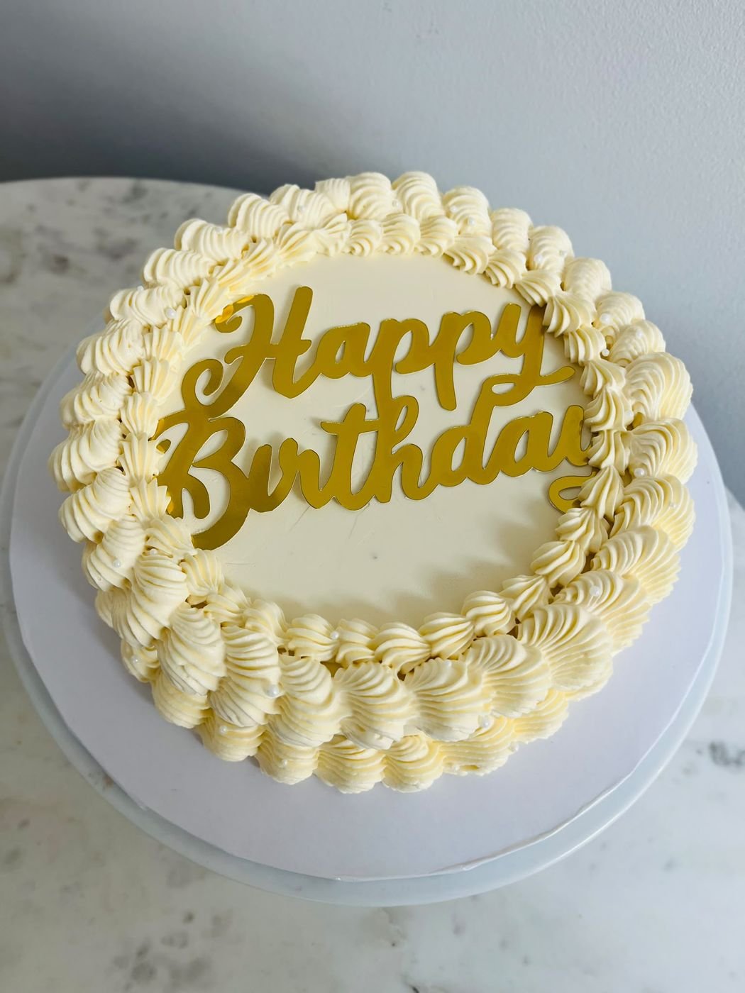 Vintage piped Happy Birthday cake