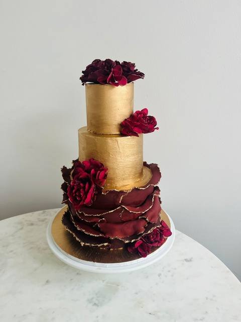 Gold and burgundy tiered cake